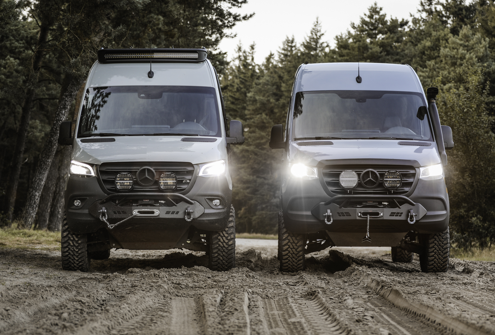 Two Mercedes Sprinters front views both with the Sequoia winch bumper.